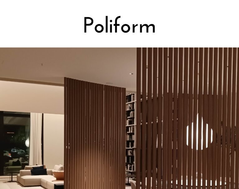 Interior lounge with a tall brown vertical slat partition dividing seating areas.