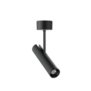 Close-up of a black outdoor street lamp with a cylindrical head on a tall pole against a black background.