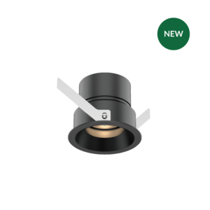 Close-up of a gray cylindrical machine part with white brackets on a black background, plus a green circular NEW badge in the upper right corner.