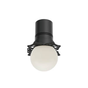 Close-up of a dark gray cylindrical object with a rounded top, mounted on a perforated circular base, against a black background.